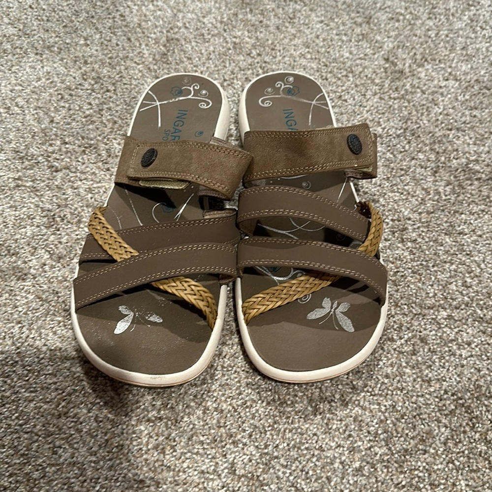 Woman’s gently worn sandal.